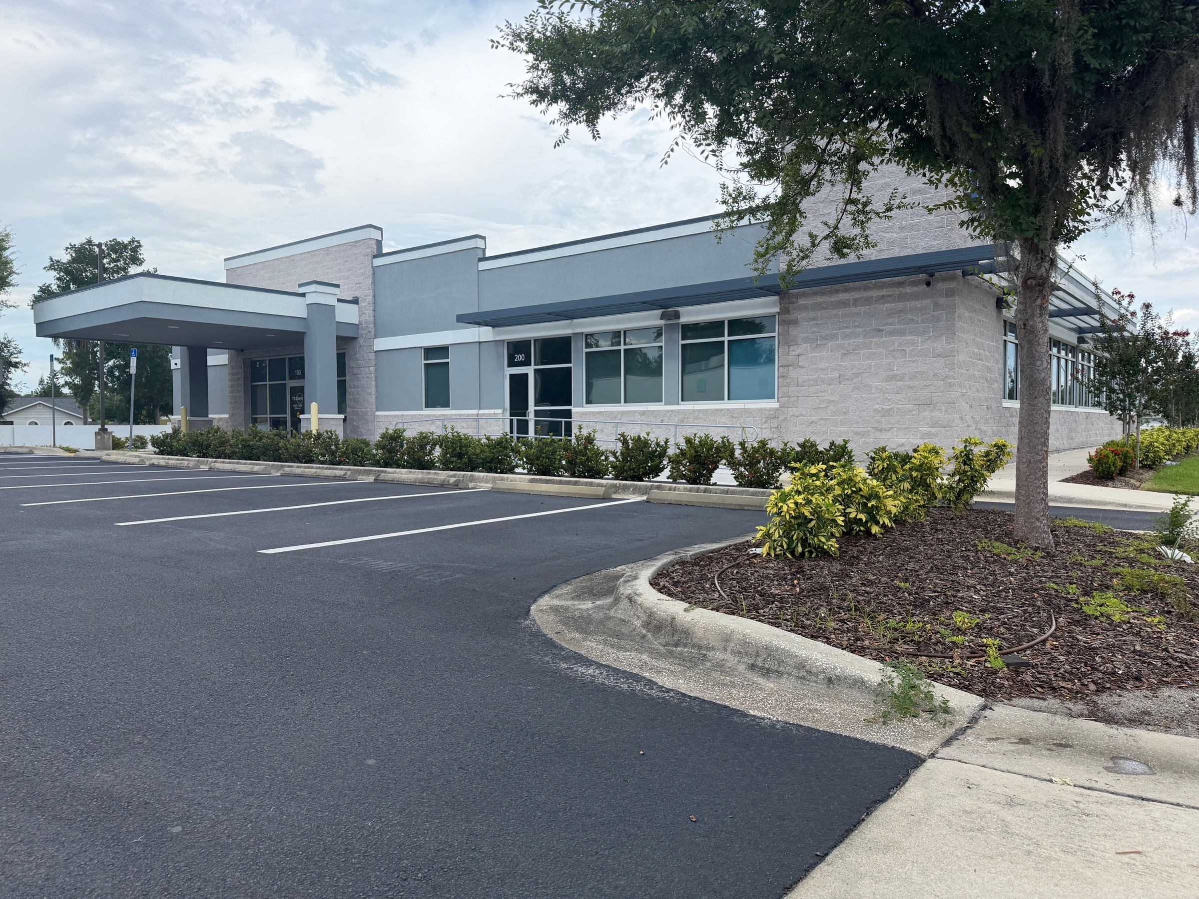 Covered entrance canopy and landscaped parking island