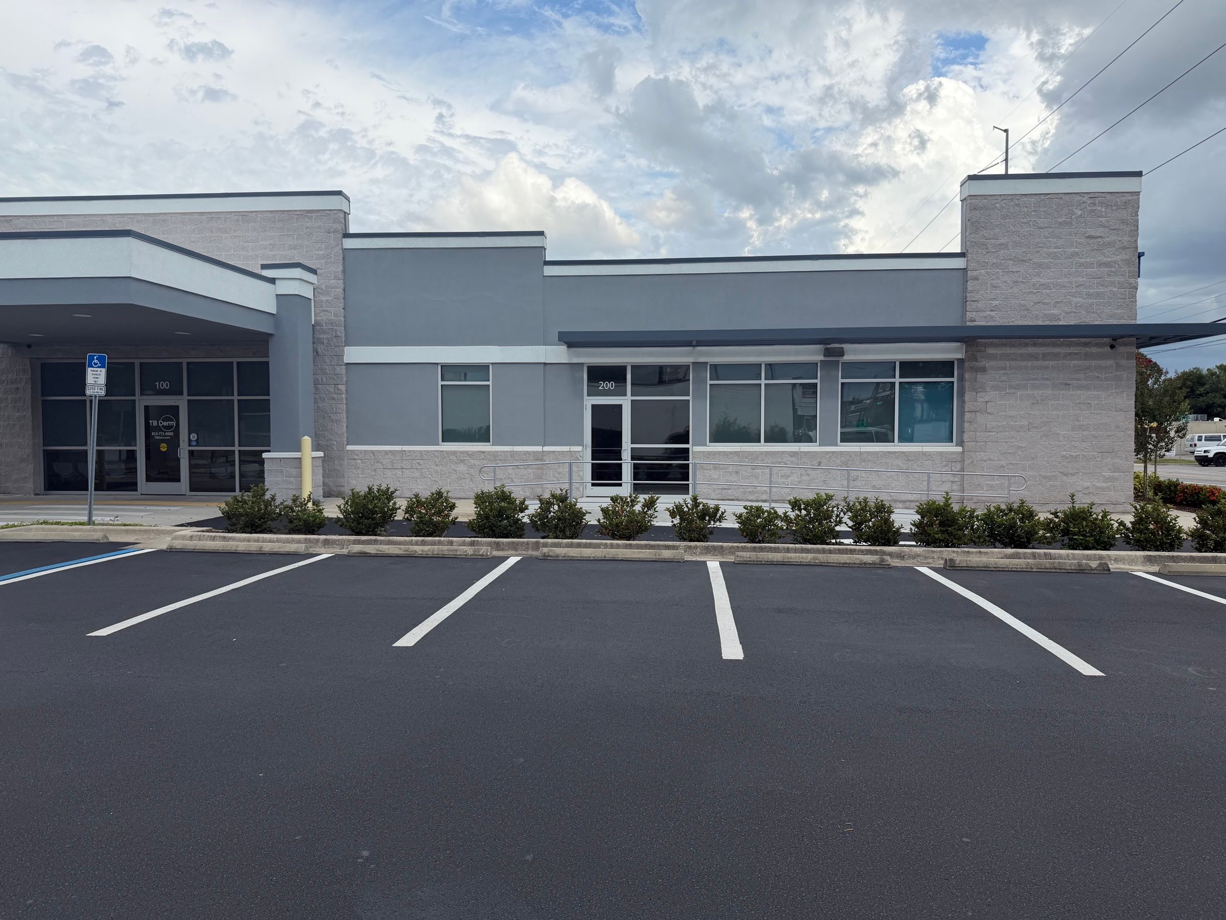 Suite 200 glass storefront entrance at 2301 W Dr. MLK Jr. Blvd